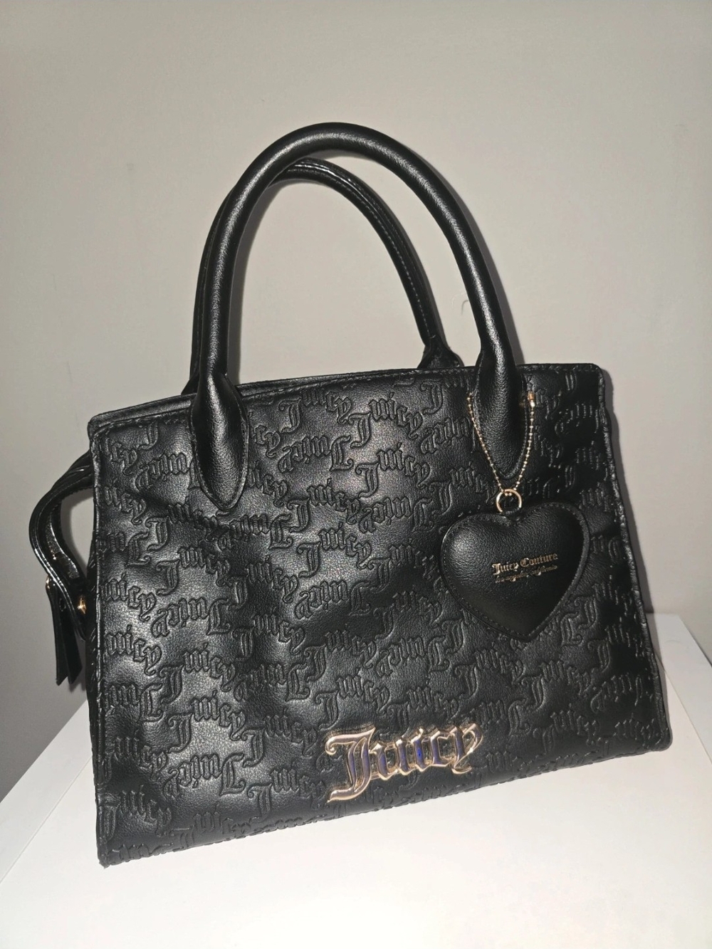 Juicy Couture Black Embossed Satchel with Heart Charm and Gold Tone Logo